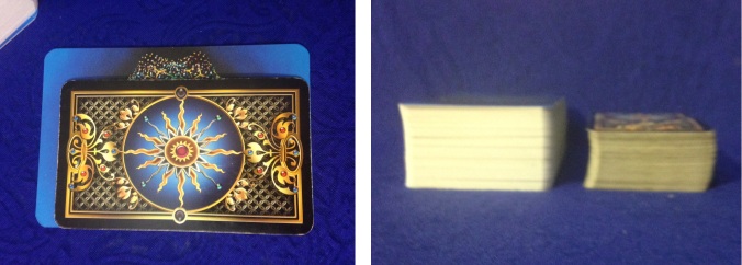 Comparing the size of the Voyager Tarot to the Gilded Tarot. The first picture has the Voyager underneath the Gilded, while the second shows the two decks stacked side by side.